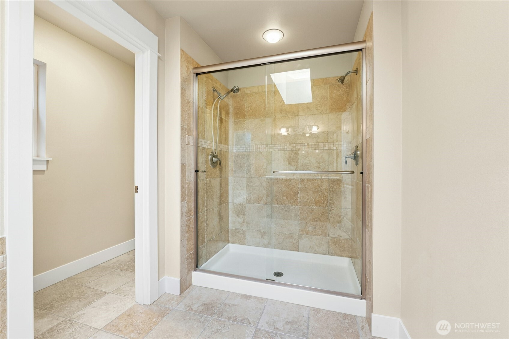 16555 Carlyle Hall Road North Shoreline, WA 98133 - Photo 15 of 27 a bathroom with a shower and a tub