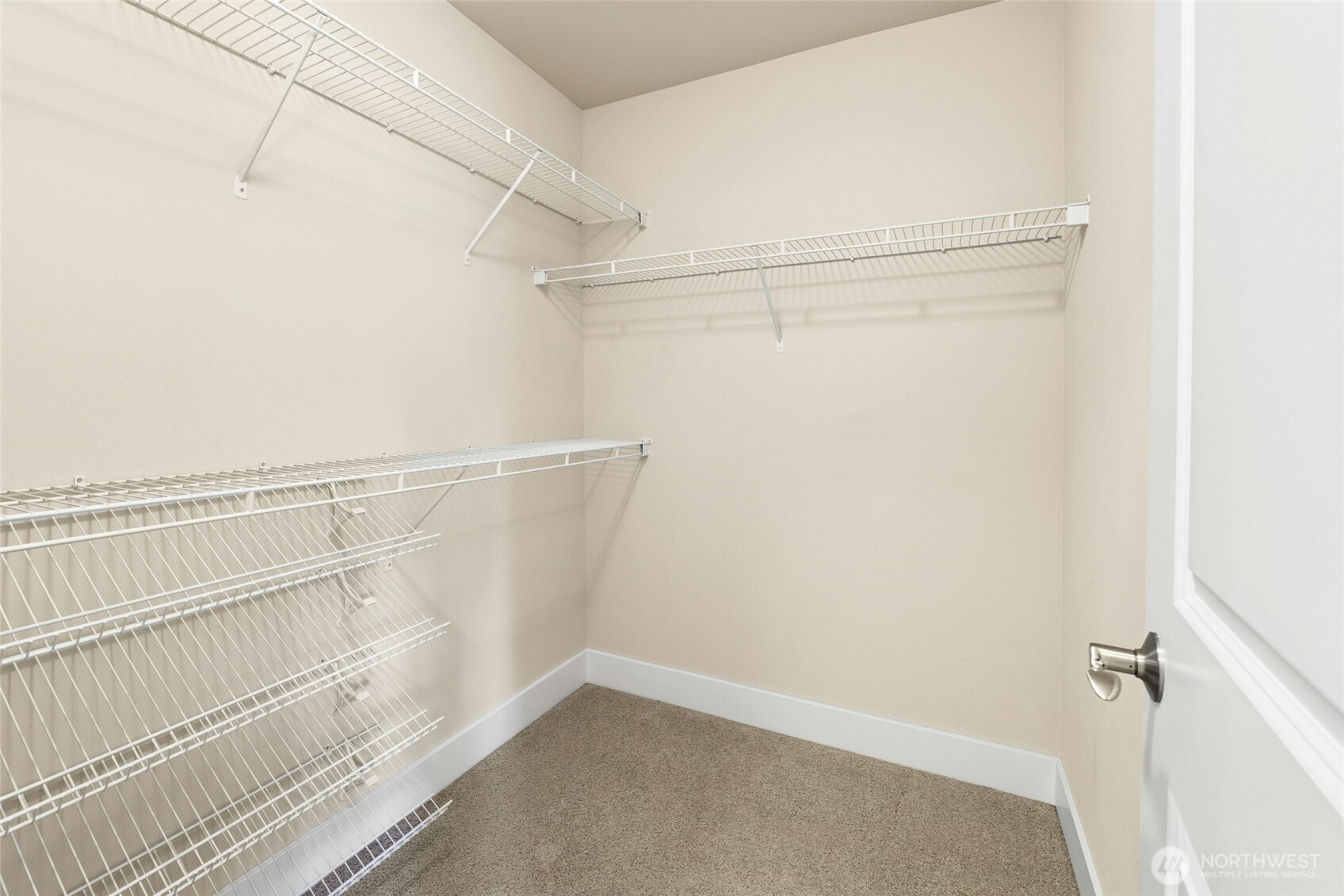 16555 Carlyle Hall Road North Shoreline, WA 98133 - Photo 16 of 27 a view of walk in closet with empty racks