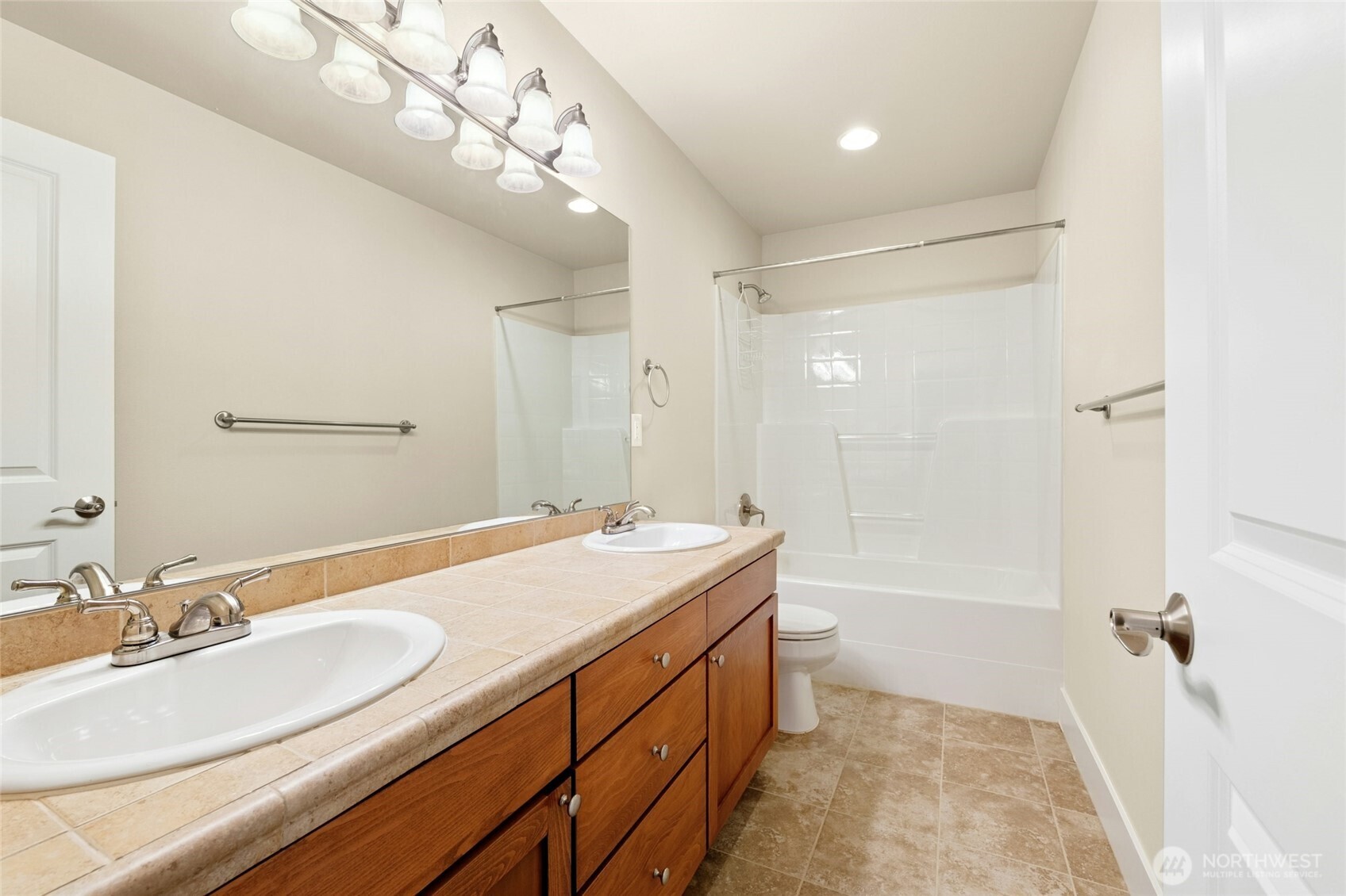 16555 Carlyle Hall Road North Shoreline, WA 98133 - Photo 18 of 27 a bathroom with a sink double vanity granite tub and shower