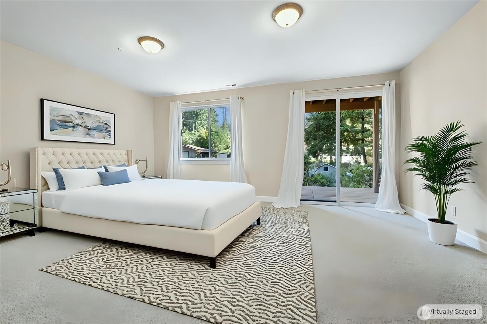 16555 Carlyle Hall Road North Shoreline, WA 98133 - Photo 20 of 27 a bedroom with a large bed and a large window