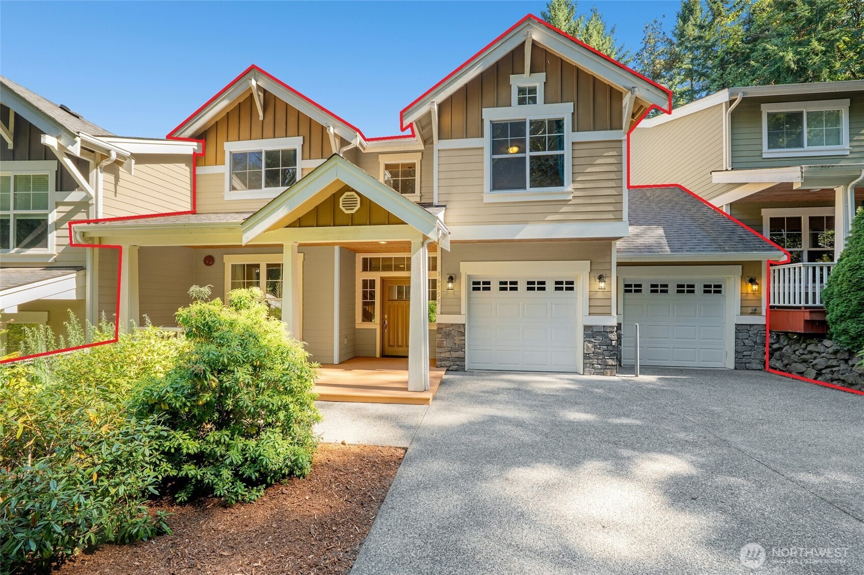 16555 Carlyle Hall Road North Shoreline, WA 98133 - Photo 2 of 27 a front view of a house with a yard and garage