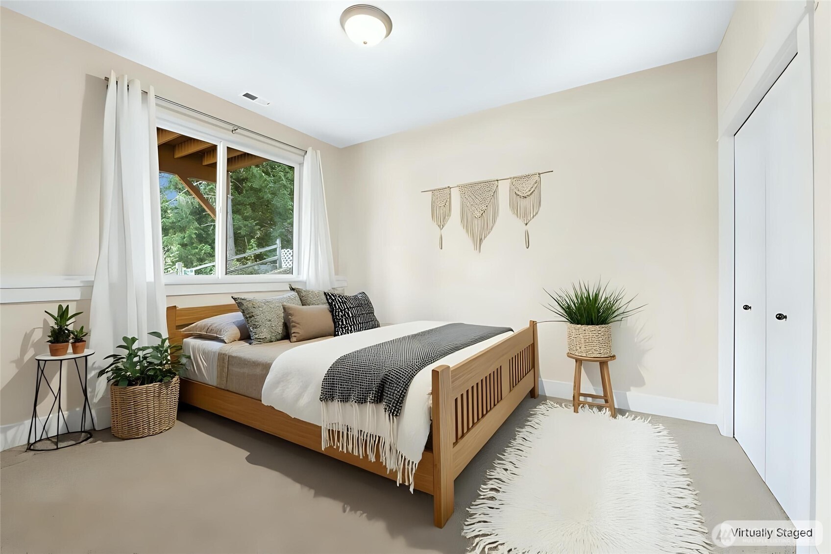 16555 Carlyle Hall Road North Shoreline, WA 98133 - Photo 21 of 27 a spacious bedroom with a bed and a window