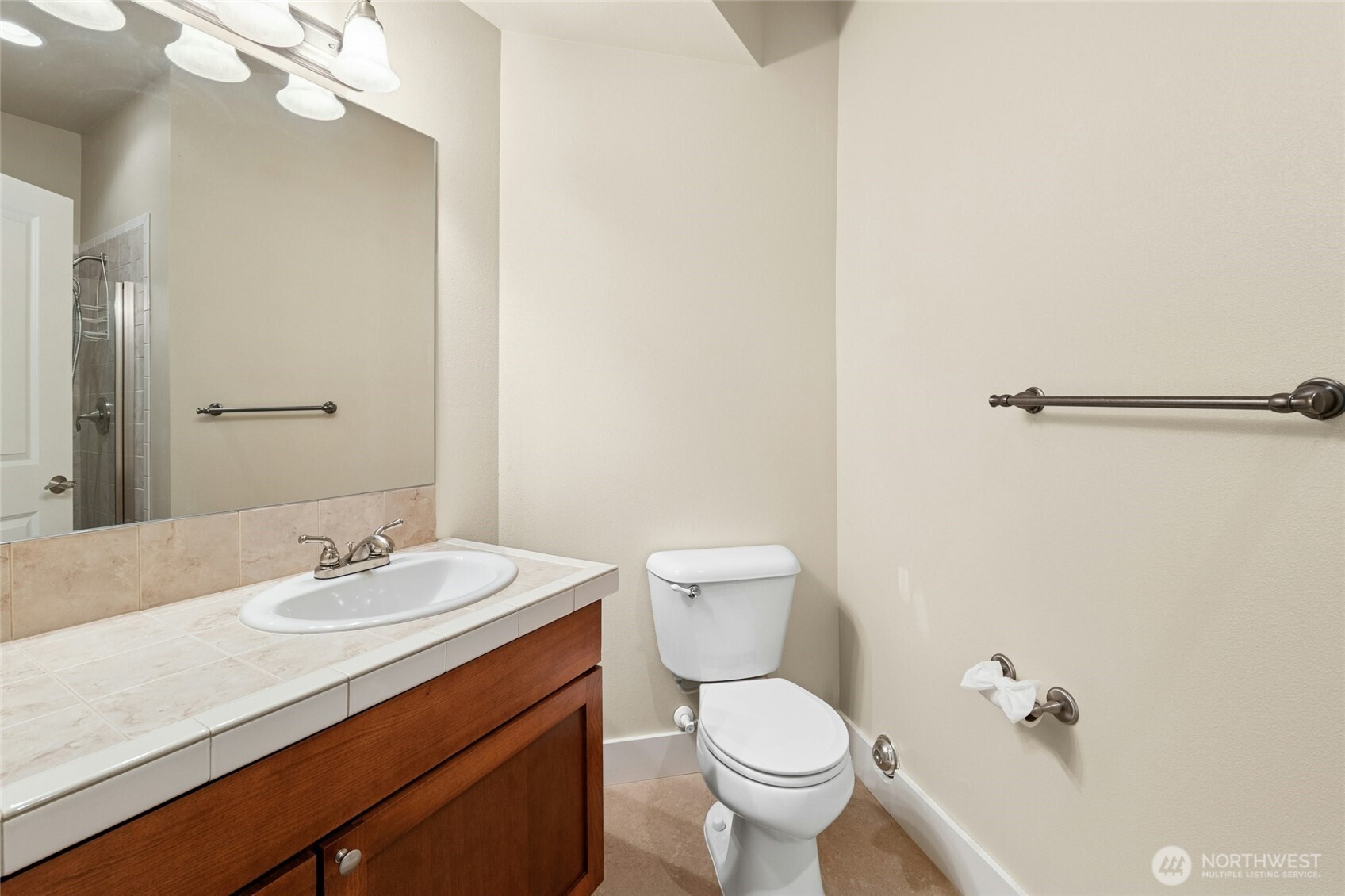 16555 Carlyle Hall Road North Shoreline, WA 98133 - Photo 23 of 27 a bathroom with a sink a toilet and shower