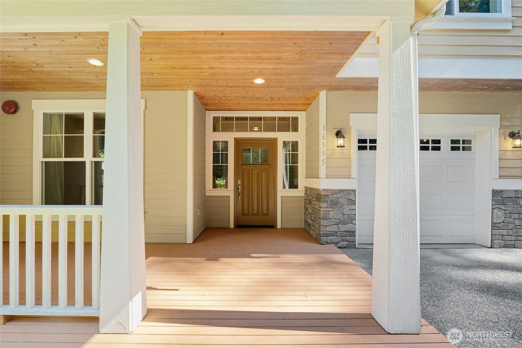 16555 Carlyle Hall Road North Shoreline, WA 98133 - Photo 4 of 27 a view of a porch with a table and chairs