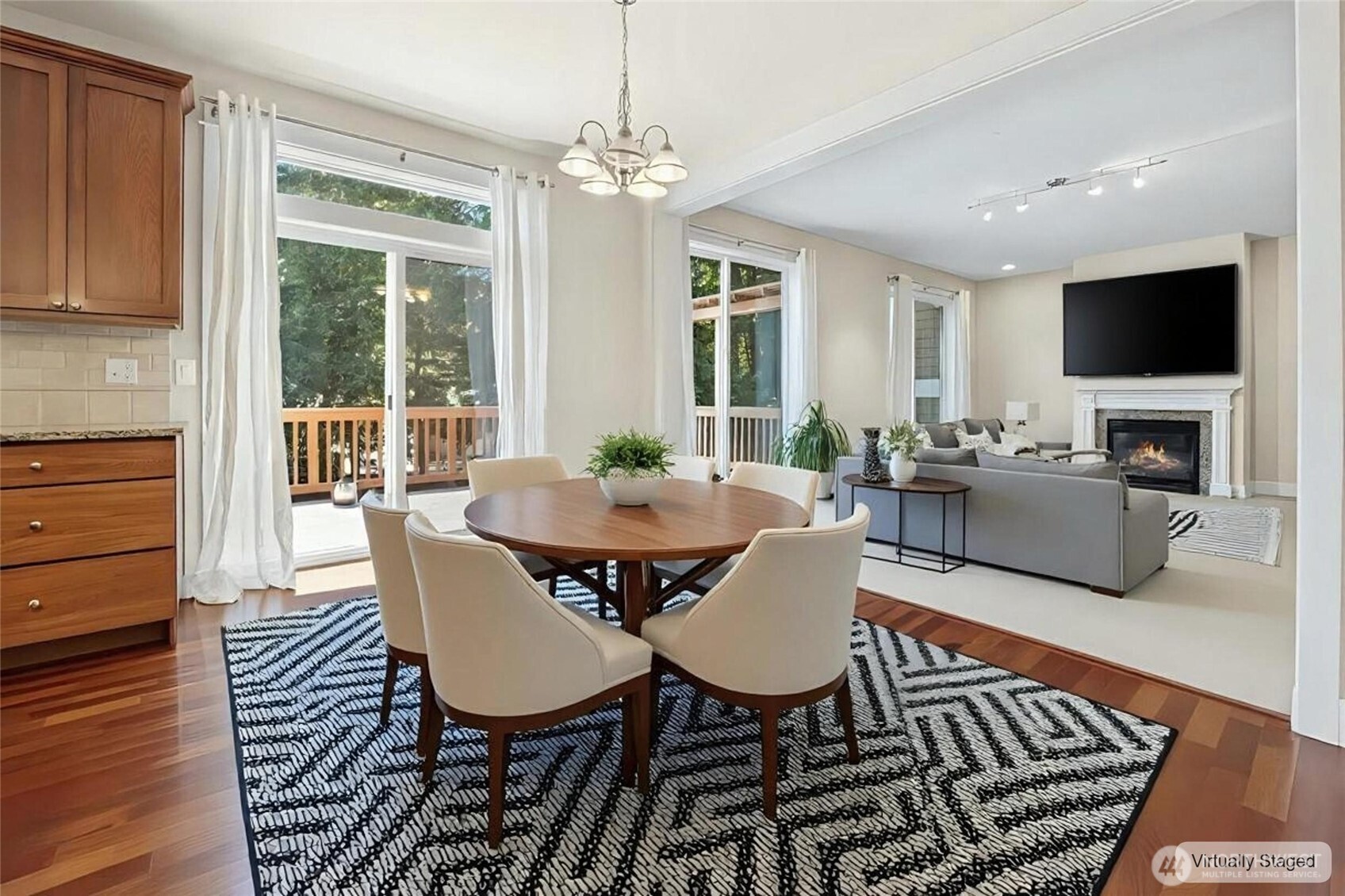 16555 Carlyle Hall Road North Shoreline, WA 98133 - Photo 9 of 27 a view of a dining room with furniture window and wooden floor