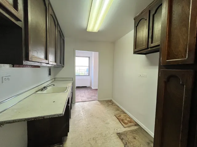 a bathroom with a sink a mirror and bathtub