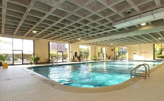 a view of a swimming pool with a patio