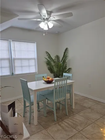 a dining room with furniture and window