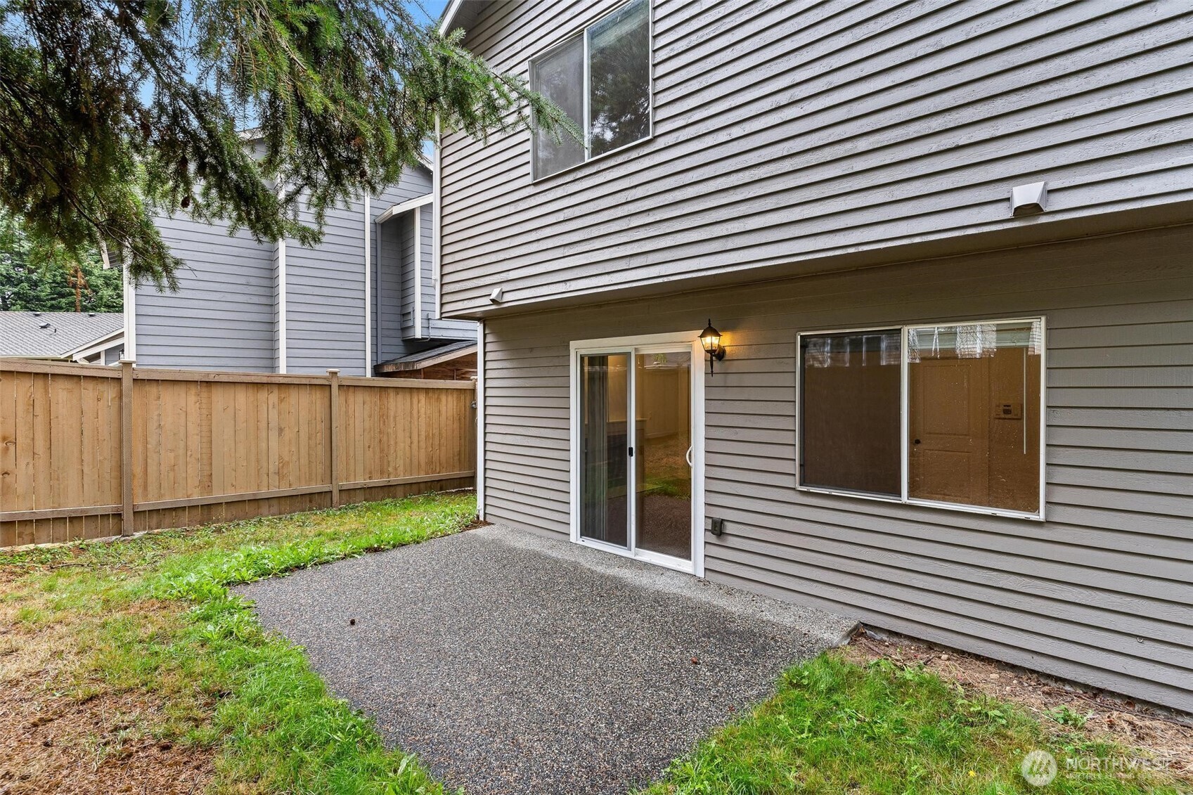 604 213th Street Southwest Bothell, WA 98021 - Photo 34 of 40 a front view of a house with a yard and garage