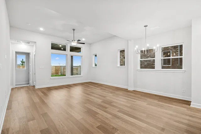 a view of kitchen with wooden floor and window