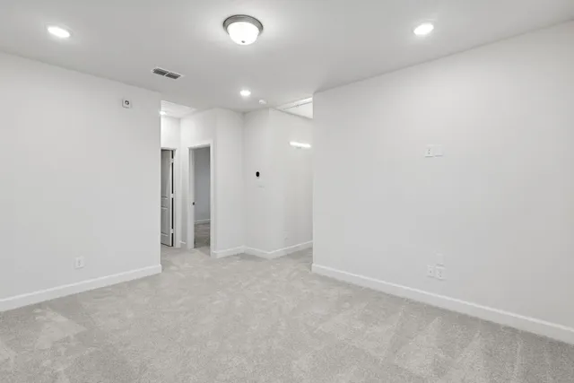 a view of hallway with windows