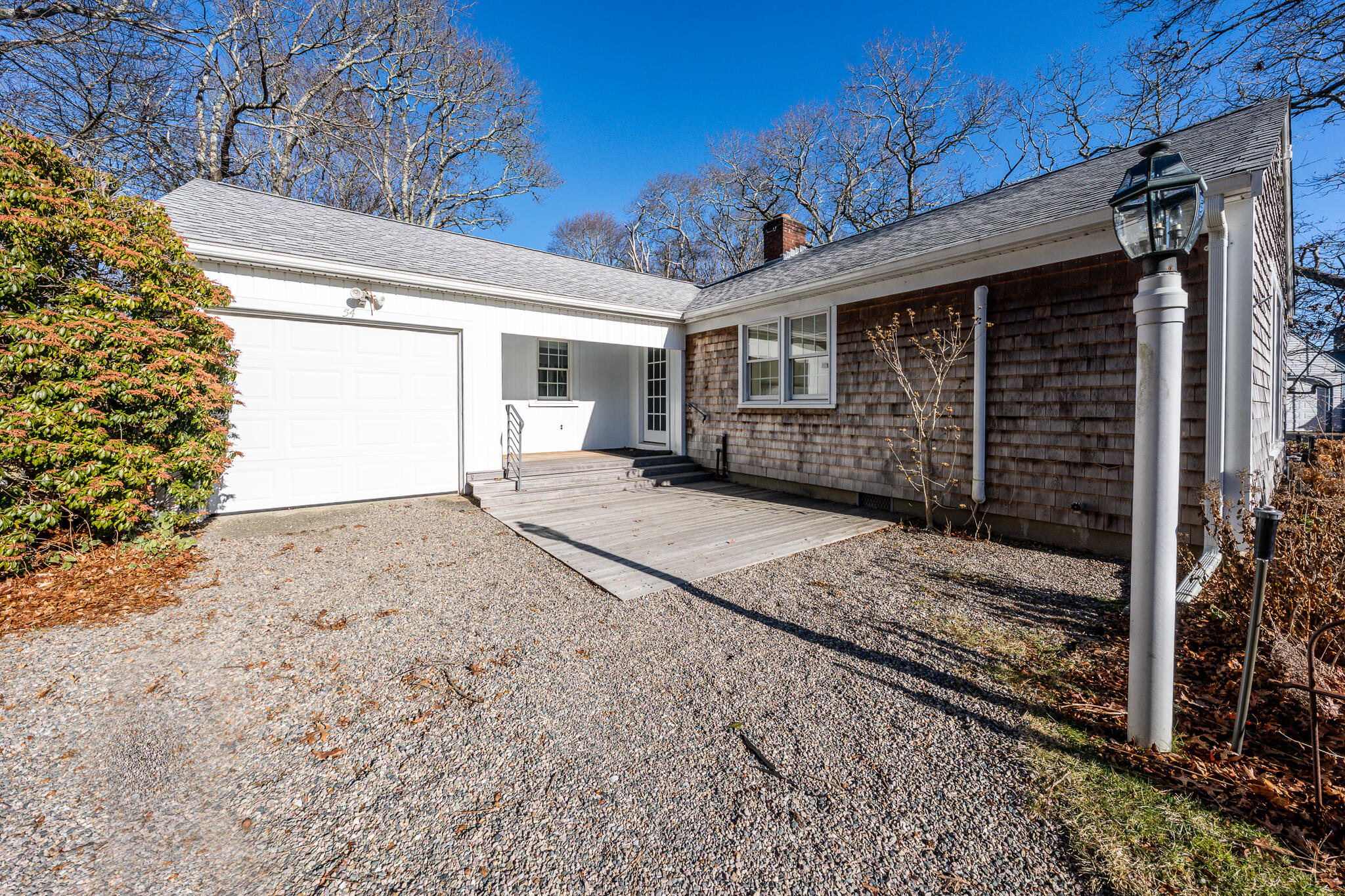 a view of a house with a yard and garage