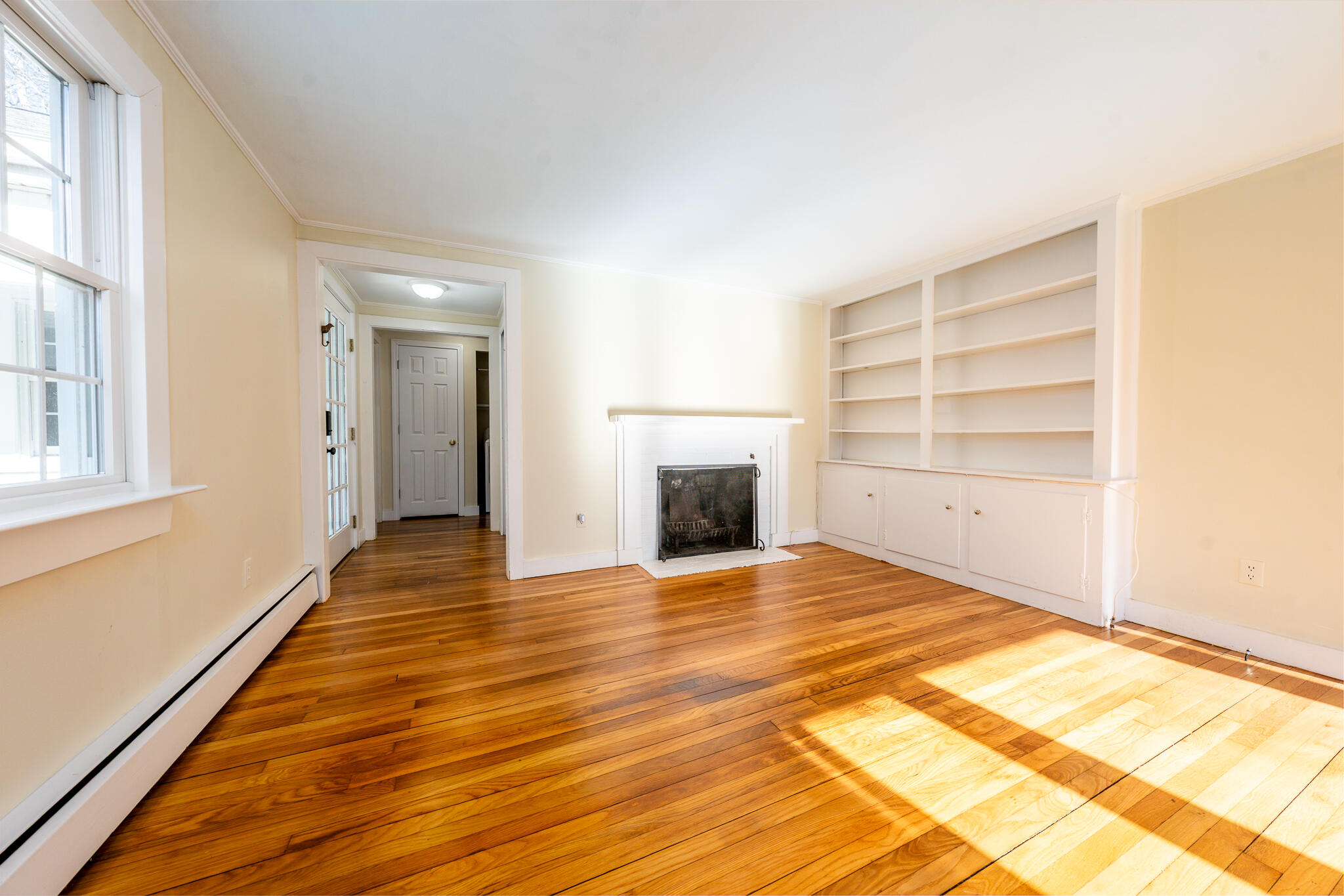 54 Murphy Road Hyannis, MA 02601 - Photo 12 of 30 a view of empty room with a fireplace and wooden floor