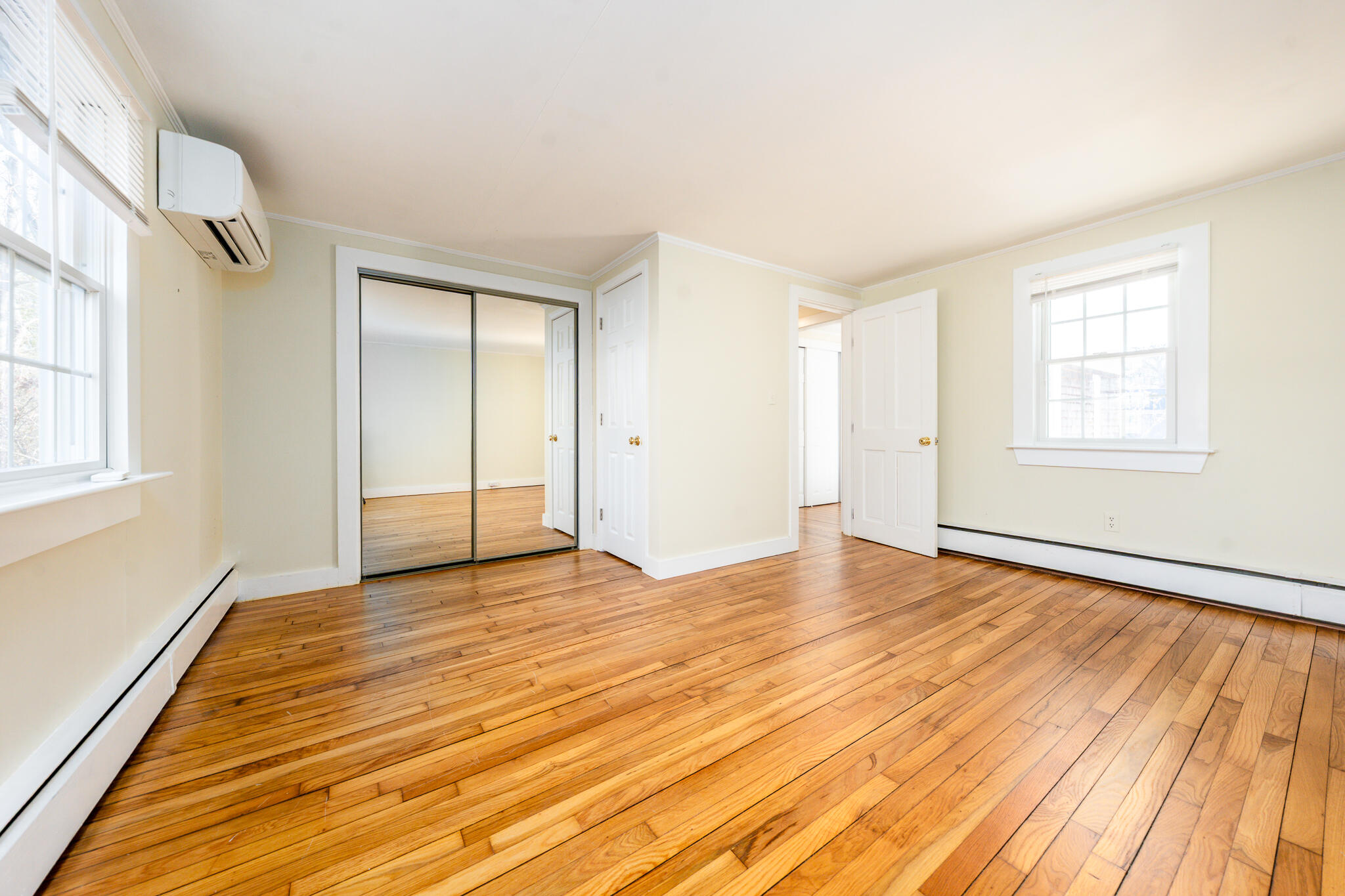 54 Murphy Road Hyannis, MA 02601 - Photo 24 of 30 an empty room with wooden floor and windows