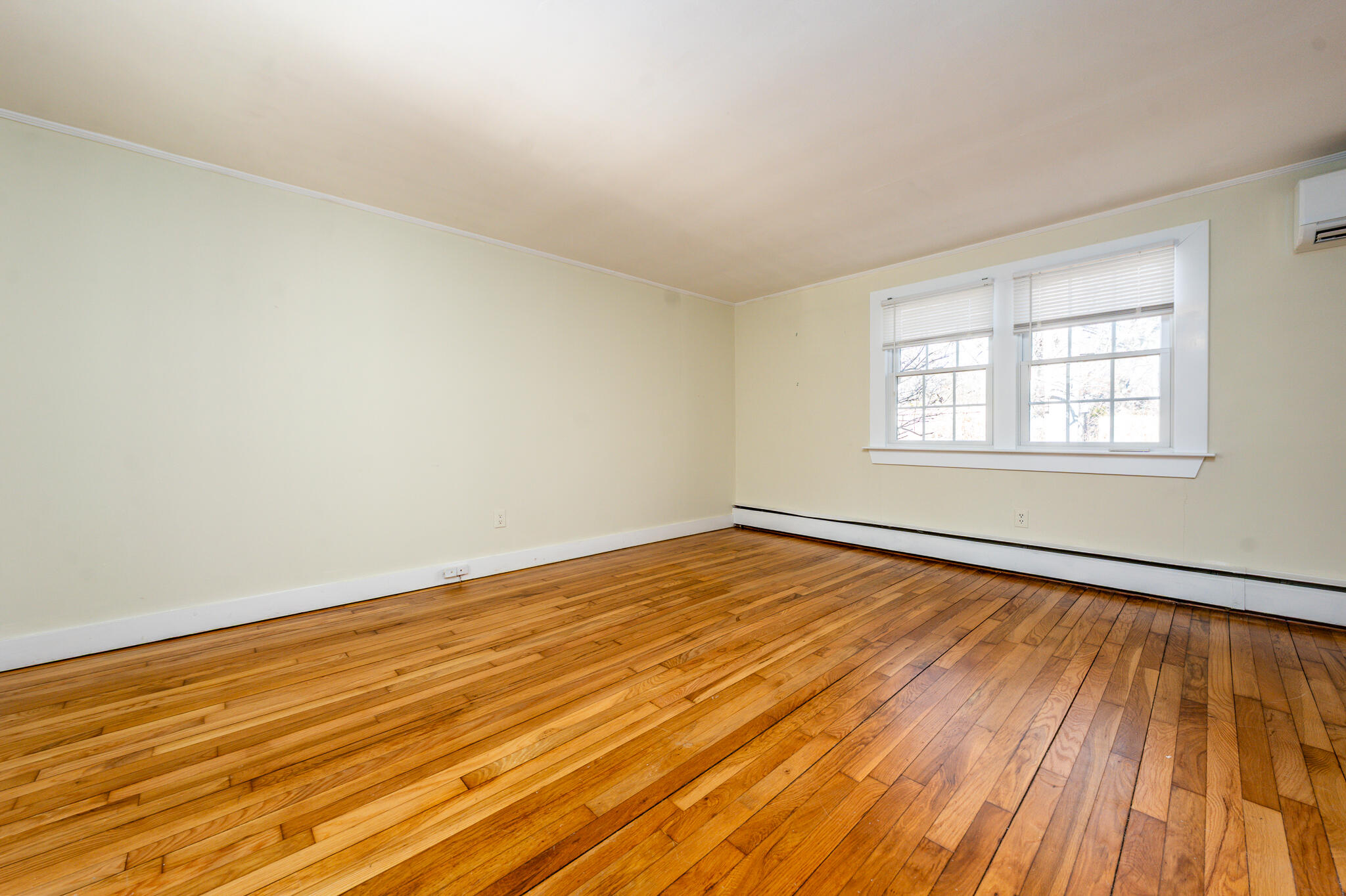 54 Murphy Road Hyannis, MA 02601 - Photo 25 of 30 an empty room with wooden floor and windows