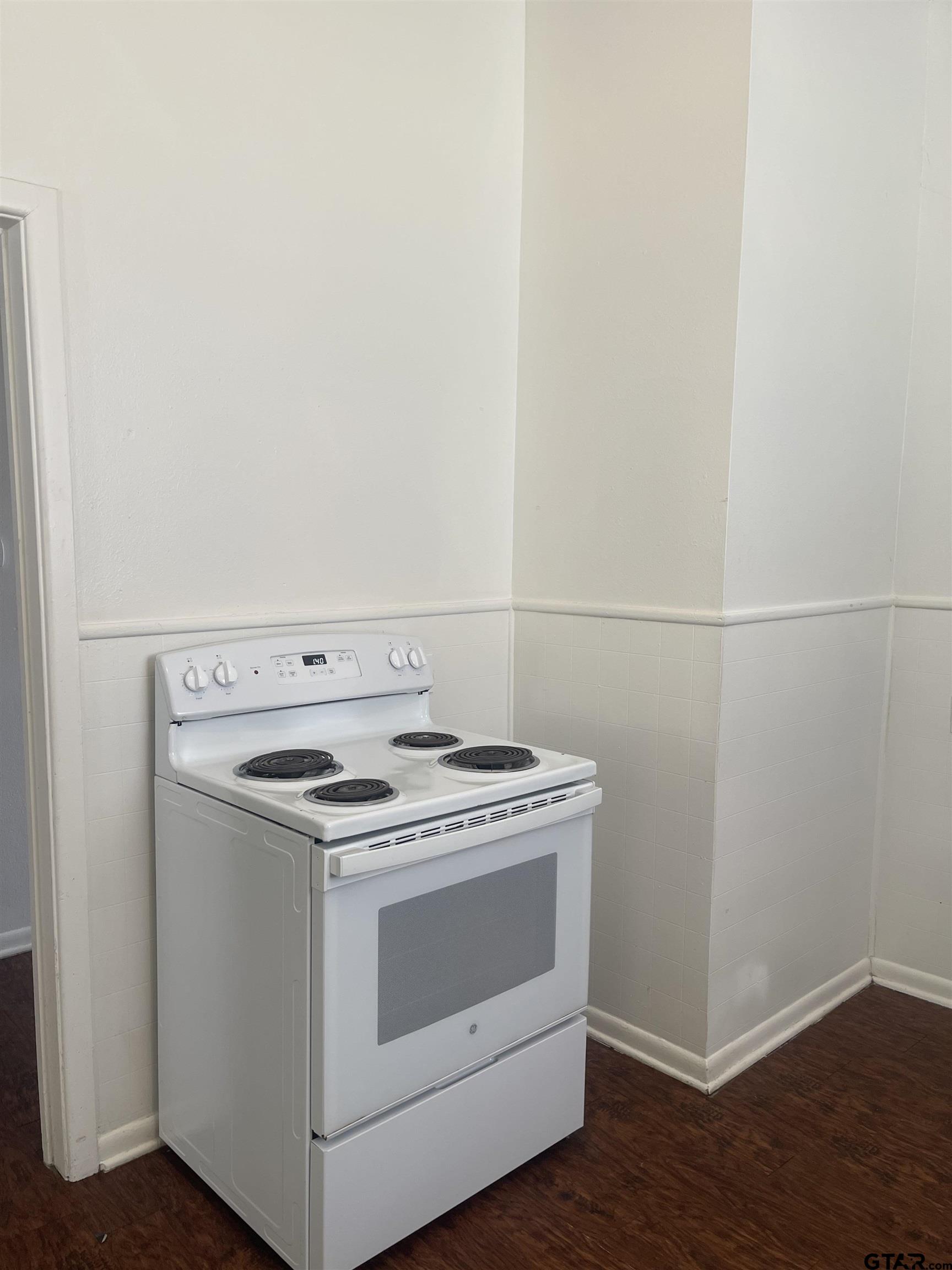 306 South Fenton Avenue Tyler, TX 75702 - Photo 5 of 11 a stove top oven sitting inside of a kitchen