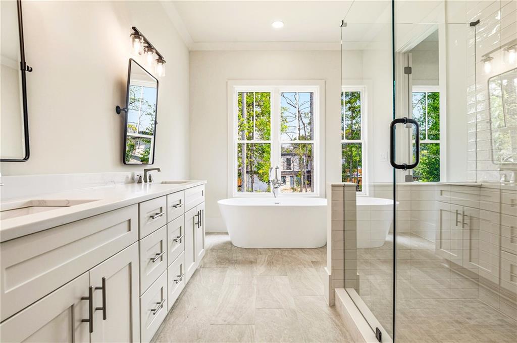 1967 Highgrove Court Decatur, GA 30033 - Photo 21 of 60 a spacious bathroom with sink shower and mirror
