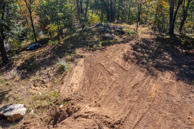 a backyard of a house with lots of green space