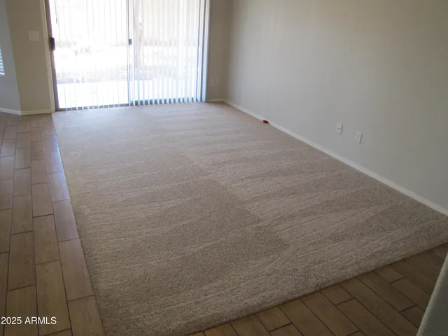 a view of an empty room and a window