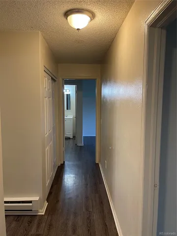 a view of hallway with wooden floor