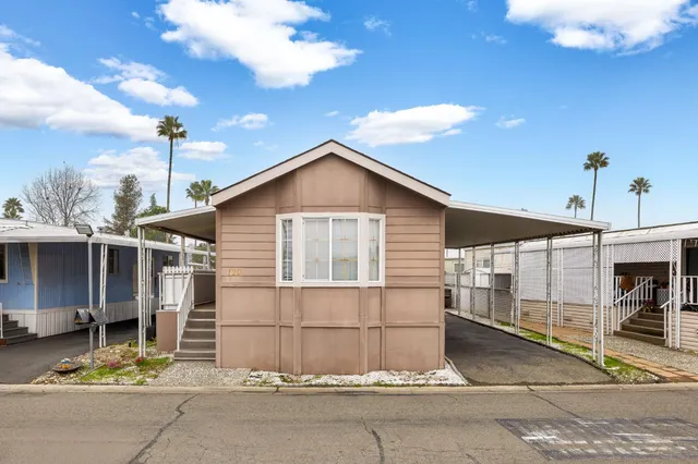 a front view of a house with a garage