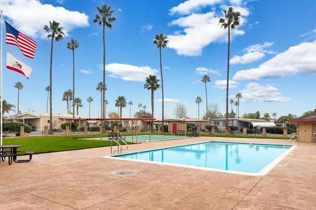 a view of a swimming pool and houses