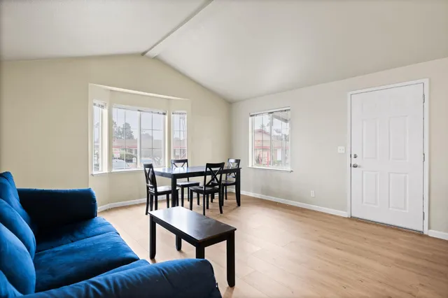 a view of a livingroom with furniture and wooden floor