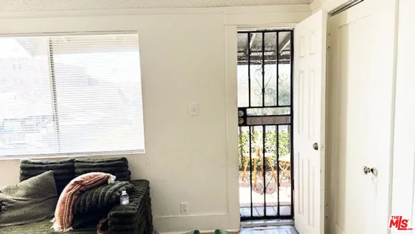 a room with a bed and a window
