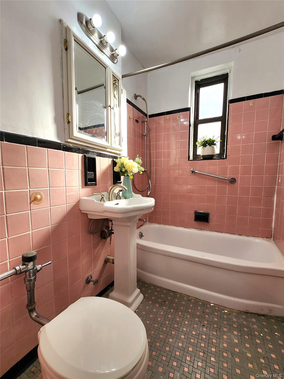 33-27 91st Street, Unit 1J Queens, NY 11372 - Photo 11 of 27 a bathroom with a sink toilet and shower