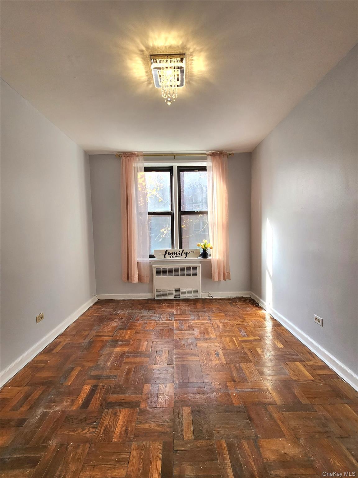 33-27 91st Street, Unit 1J Queens, NY 11372 - Photo 14 of 27 a view of a livingroom with a window
