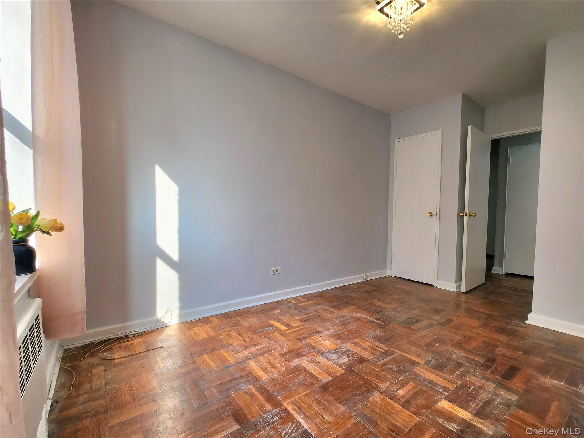33-27 91st Street, Unit 1J Queens, NY 11372 - Photo 15 of 27 an empty room with a bathroom