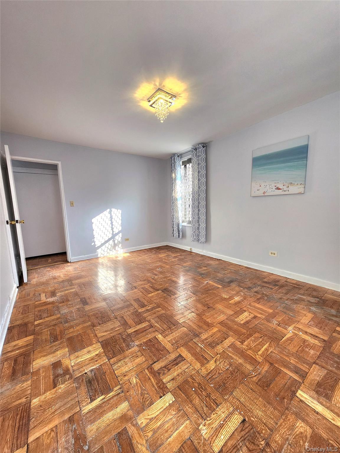33-27 91st Street, Unit 1J Queens, NY 11372 - Photo 17 of 27 a view of an empty room and window