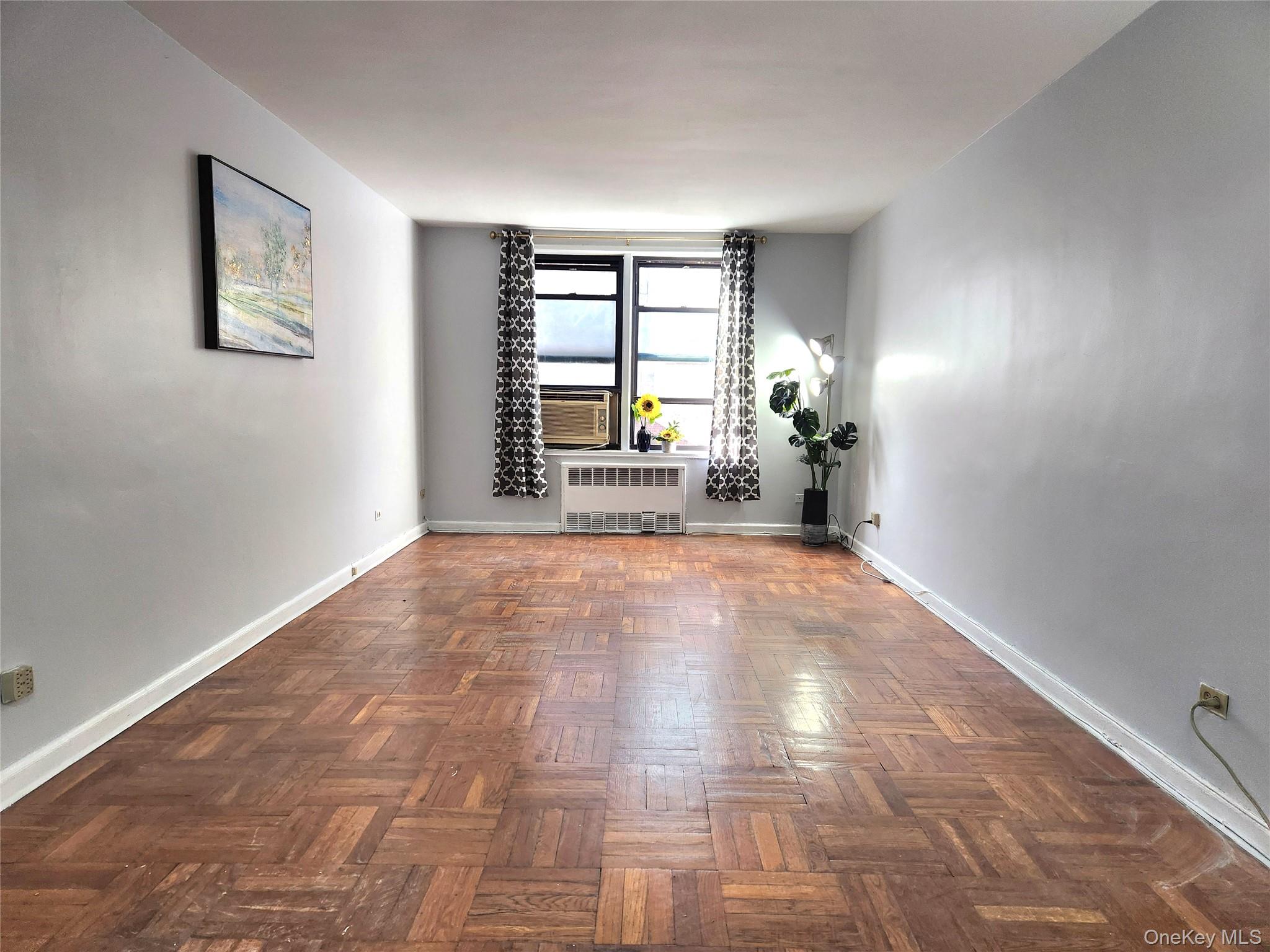 33-27 91st Street, Unit 1J Queens, NY 11372 - Photo 2 of 27 a view of empty room with a window