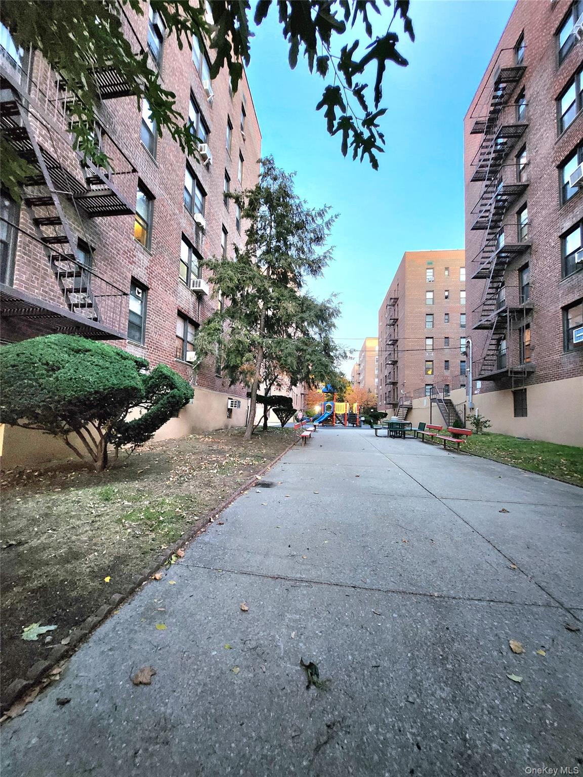 33-27 91st Street, Unit 1J Queens, NY 11372 - Photo 22 of 27 a view of a street with a building in the background