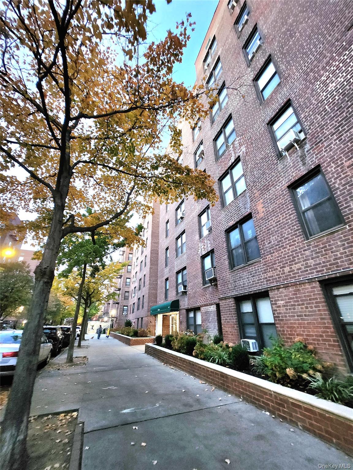 33-27 91st Street, Unit 1J Queens, NY 11372 - Photo 27 of 27 a view of a street with houses