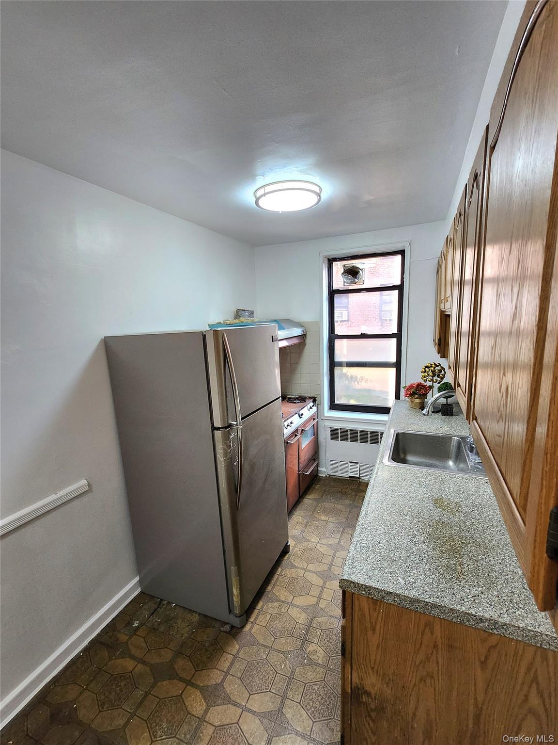 33-27 91st Street, Unit 1J Queens, NY 11372 - Photo 8 of 27 a view of a livingroom with furniture and staircase