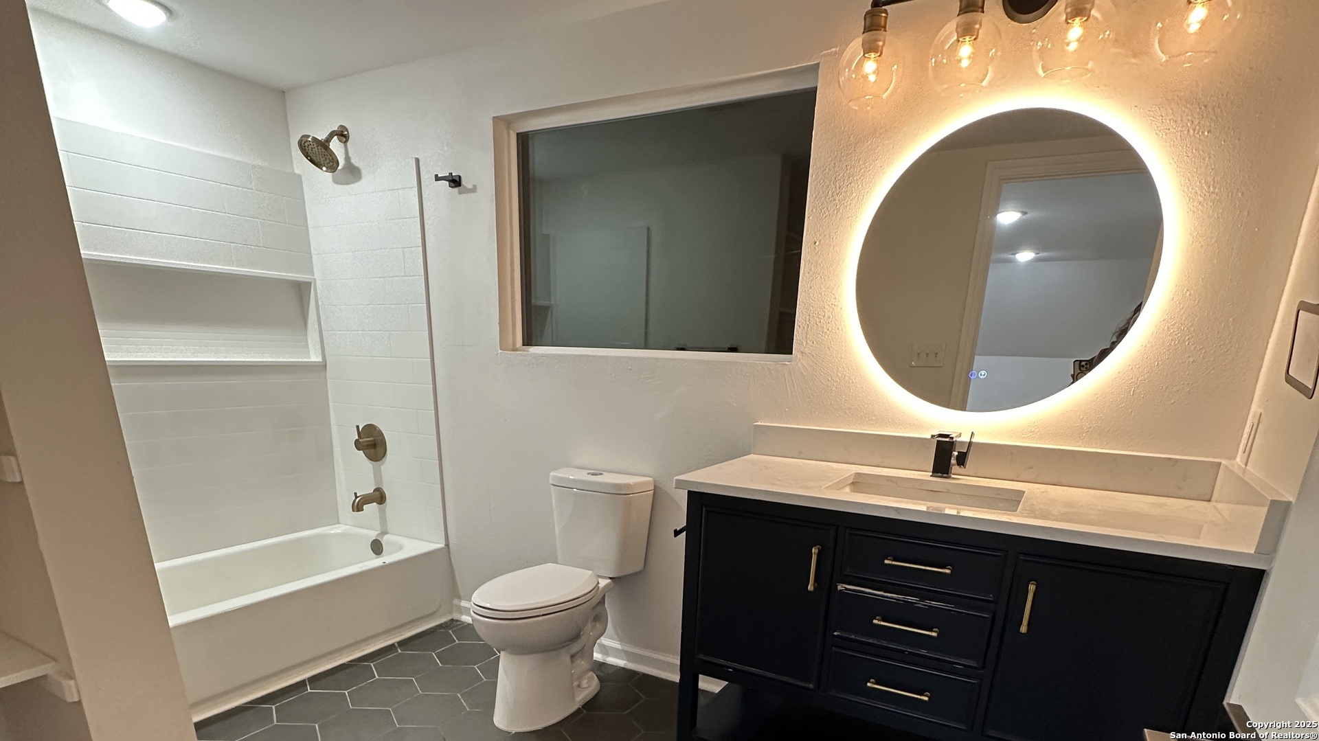 210 County Road 4643 Hondo, TX 78861 - Photo 9 of 13 a bathroom with a sink and a mirror