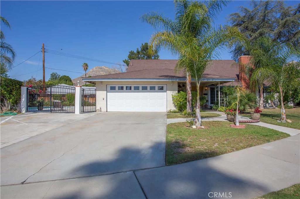355 Highlander Drive Riverside, CA 92507 - Photo 1 of 1 a view of a house with a yard and potted plants