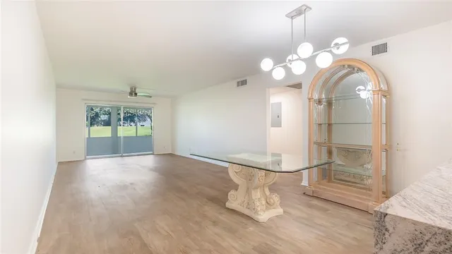 a view of a room with wooden floor