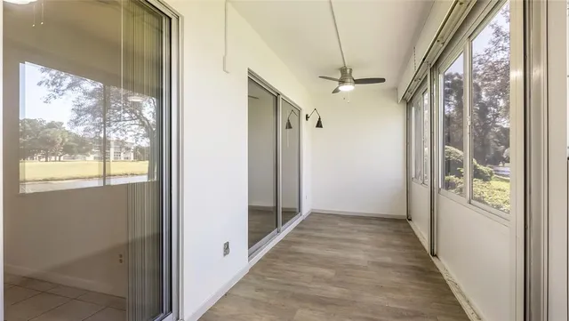 a view of hallway with windows
