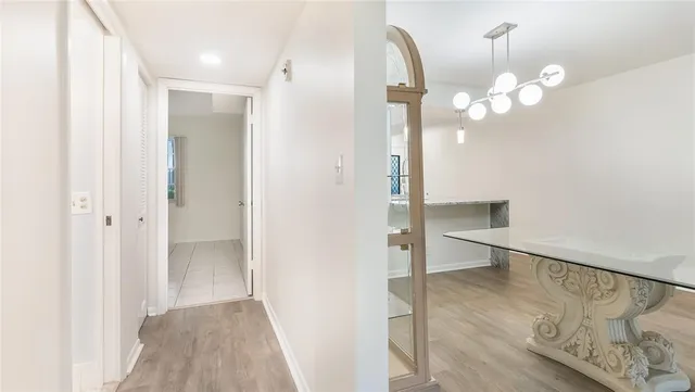 a view of a room with wooden floor and staircase