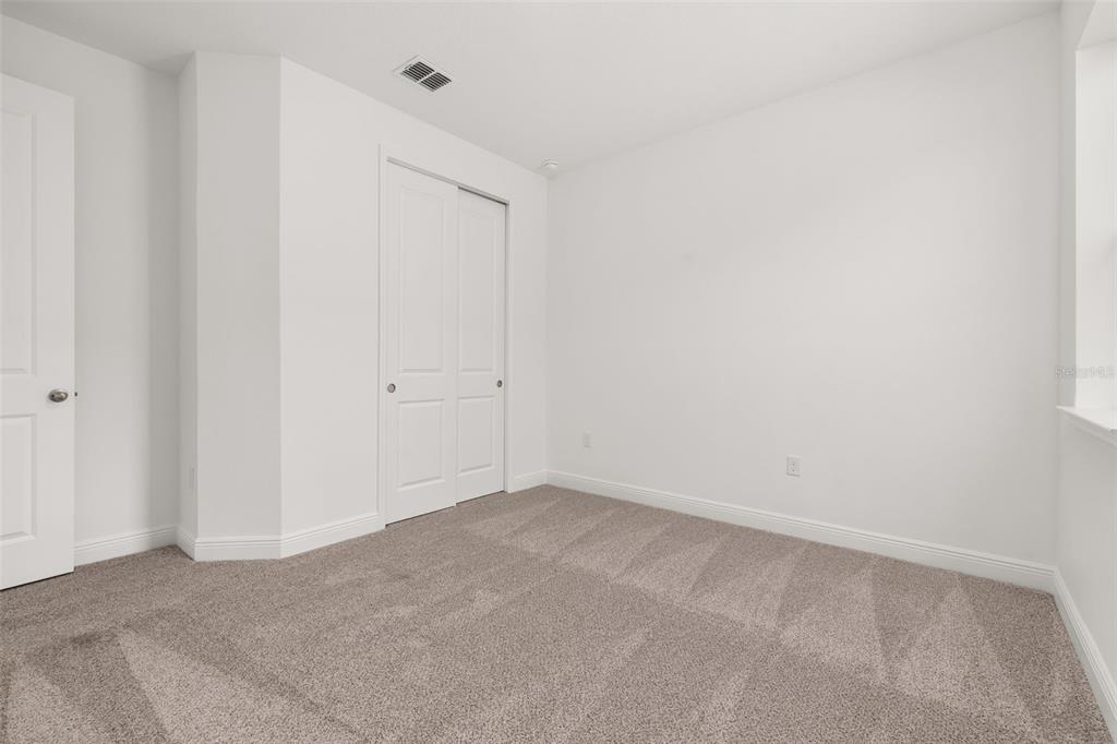 995 Fiesta Key Circle Lady Lake, FL 32159 - Photo 22 of 38 a view of an empty room