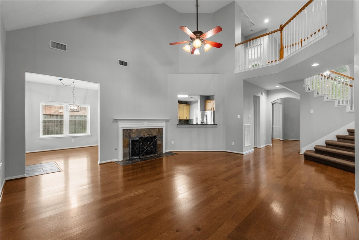 2876 Match Point Lane Friendswood, TX 77546 - Photo 16 of 45 This home offers a split staircase in the entryway and the family room, so going up and down is easy.