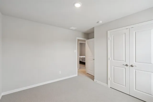 an empty room with a bathroom