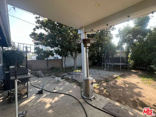a view of a backyard with sitting area