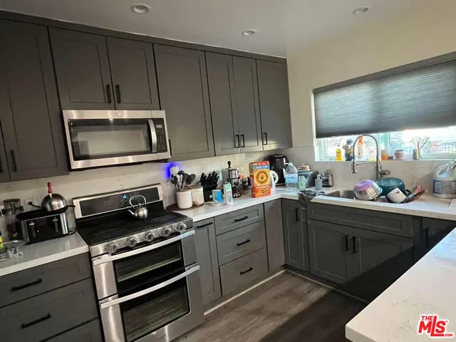 a kitchen with sink cabinets and window