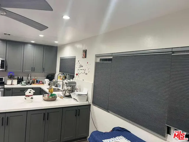 a bathroom with a sink a tub and a mirror