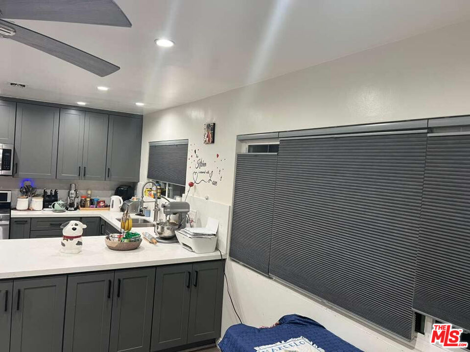 17014 Rinaldi Street Granada Hills, CA 91344 - Photo 5 of 16 a bathroom with a sink a tub and a mirror