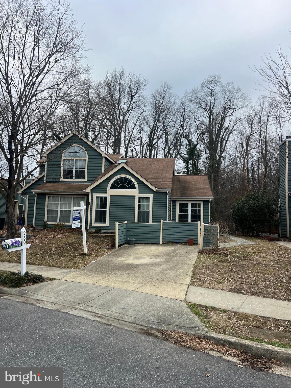 960 Yachtsman Way Annapolis, MD 21403 - Photo 1 of 24 a front view of a house with a yard