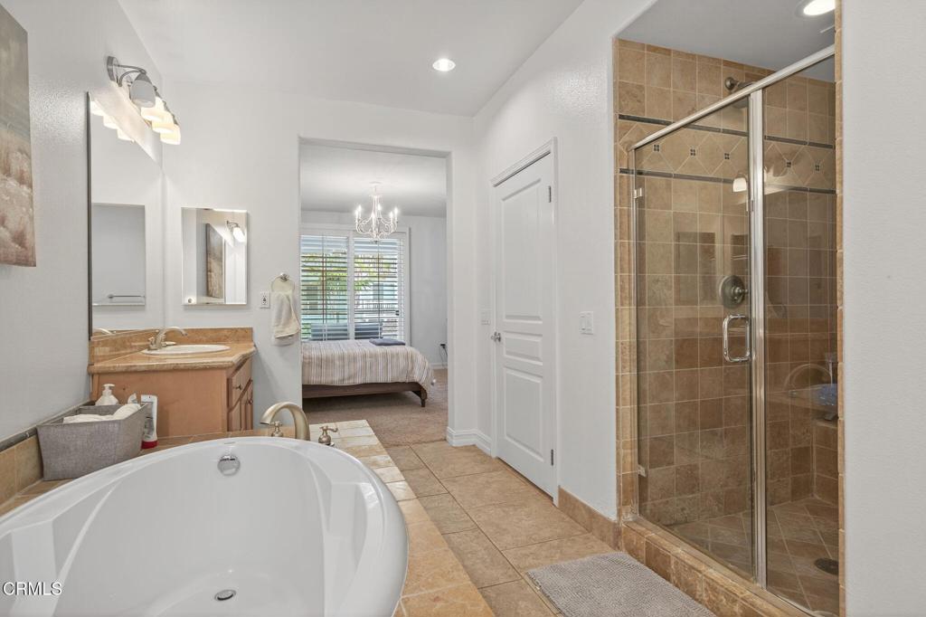 1423 Windshore Way Oxnard, CA 93035 - Photo 51 of 77 a bathroom with double vanity and a shower
